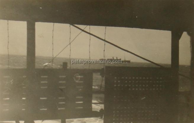 Peter Provenzano Photo Album Image_copy_123.jpg - Photo of fellow convoy ship in distance. Taken by Peter Provenzano aboard the MS Morton Bay during his return to Canada from England.  December/January of 1941.